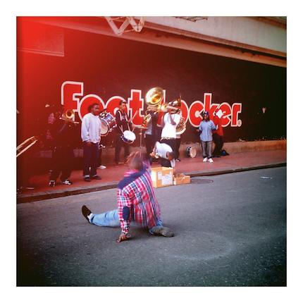 New Orleans Brass Band, live outside Canal St Foot Locker. Dancer in the middle of Bourbon St.